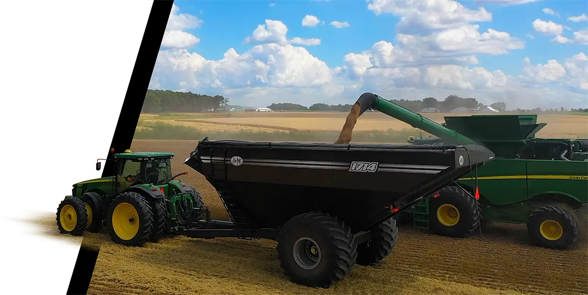 A 1114 being filled by a combine