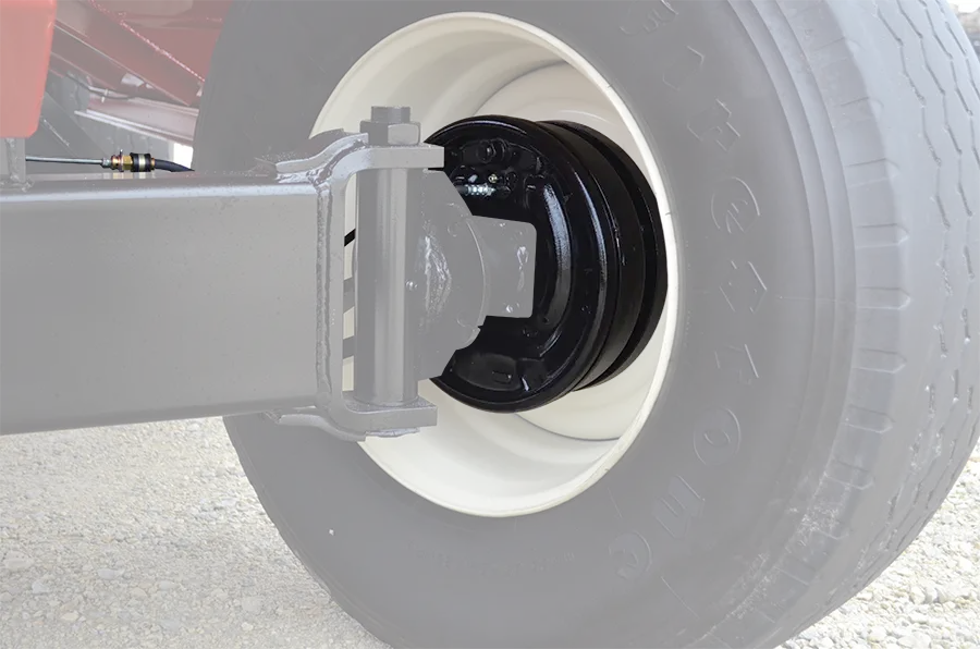 a close up of the hydraulic drum brakes on a 385 gravity wagon