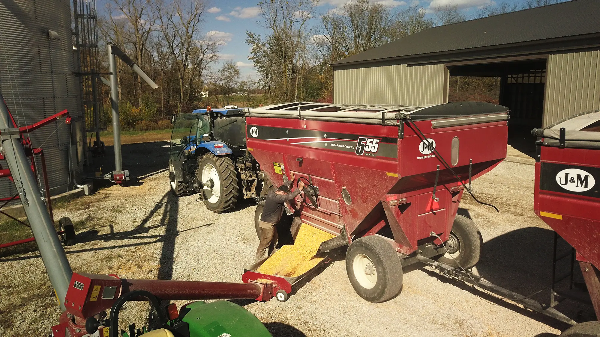 555 red gravity wagons unloading