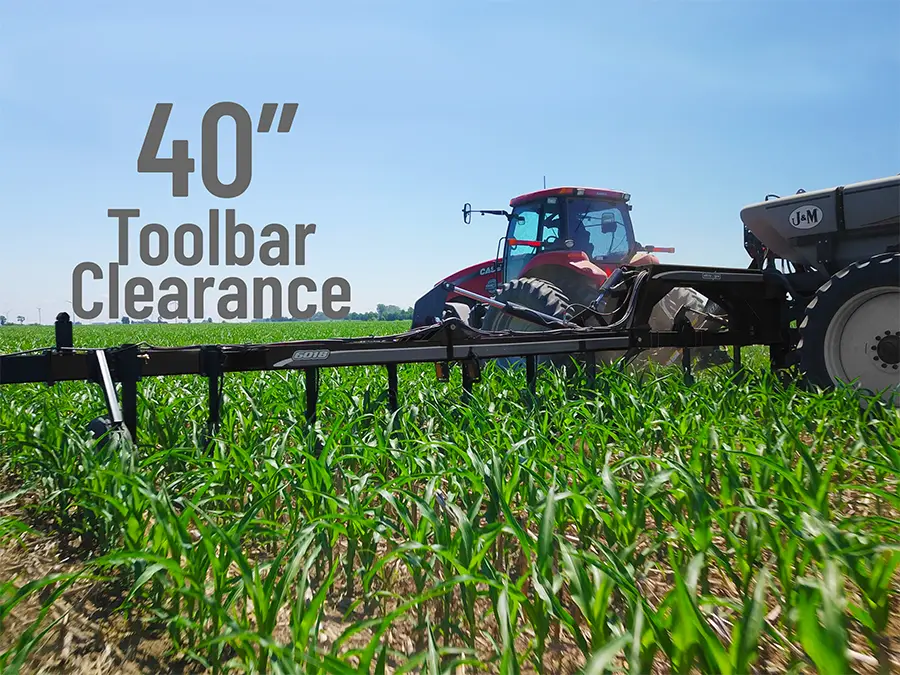 an image of an applicator in the field being pulled through tall young corn with the 40 inch toolbar clearance highlighted.