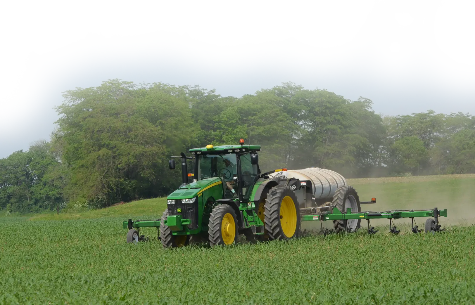Green 5016 NitroGro Nitrogen Applicator Applying Liquid Nitrogen to a Field of Corn